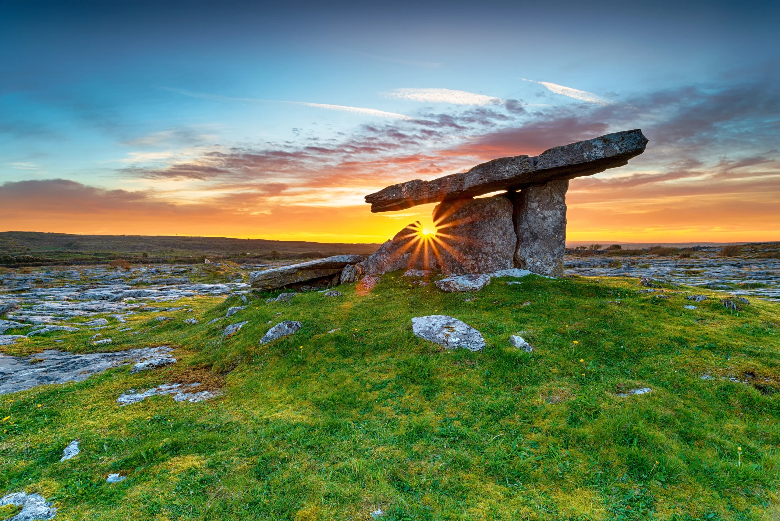 Sunset over Poulnabrone Dolmen an ancient portal tomb in the Burren County Clare