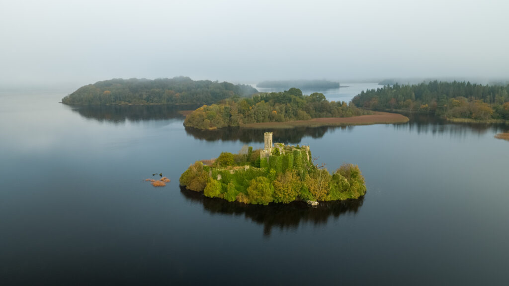 Aerial views of McDermott's Castle on Castle Island, Lough Key, Co Roscommon, Ireland