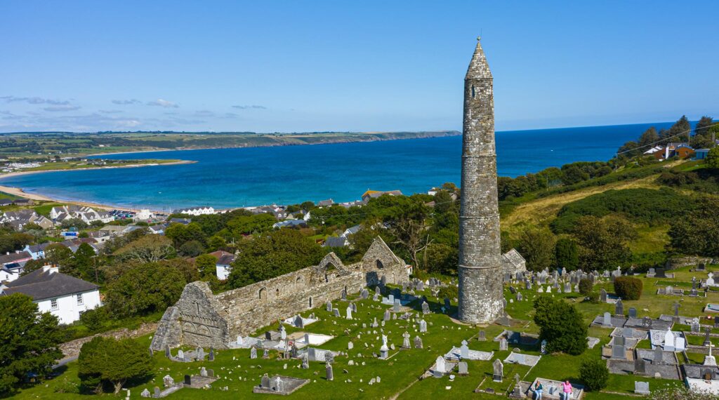 Aerial view of Ardmore Round Tower, Built in the 12h century, the tower is overlooking the coastal village of Ardmore, County Waterford, Ireland