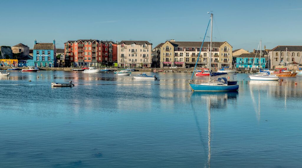 High tide with boats’ reflection in Dungarvan Bay, County Waterford, Ireland.
