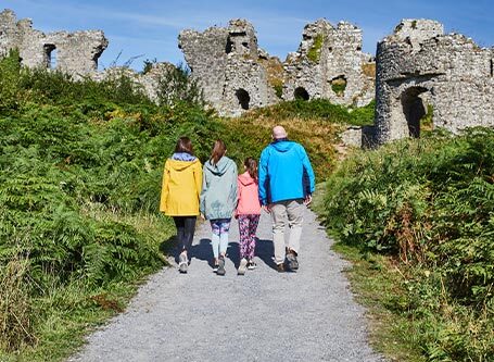 A family exploring one of Laois’s top attractions Rock of Dunamase © Failte Ireland