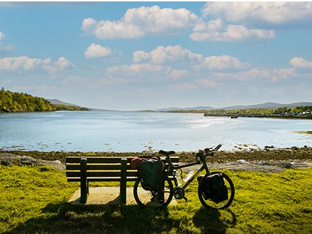 Touring bicycle set up with pannier in scenic nature by coast, Great Western Greenway in County Mayo, Ireland