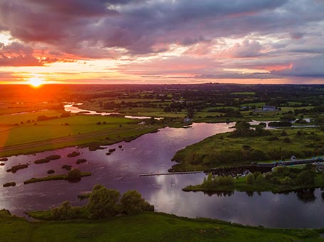 Aerial view of the fields and the Shannon River in County Offaly, sunset time