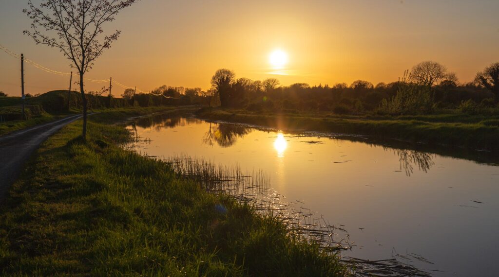 Irish Landscape sunset over canal in County Offaly, Ireland.