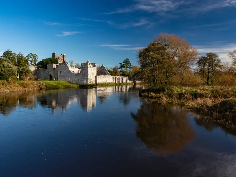 Ruins Of Desmond Castle on River Maigue in Adare, County Limerick, Ireland.