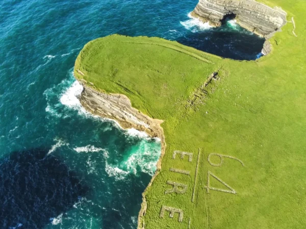 Downpatrick Head, 64 Eire mark, aerial view of the coastline in County Mayo, Ireland.
