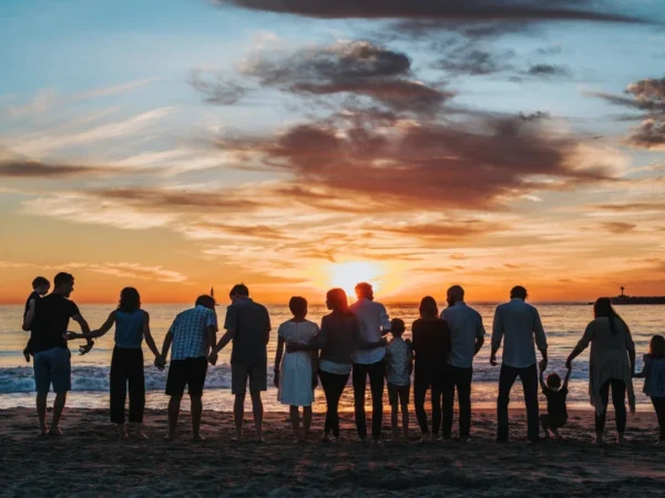 Group of friends on the beach during sunset, good for groups holiday homes in County Meath, Ireland.