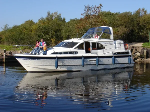 Couple enjoying a boating holidays on Lough Erne in Fermanagh © Trident Holiday Homes