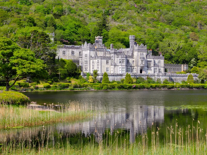 Beautiful view across Pollacapall Lough to Kylemore Abbey in Connemara Galway