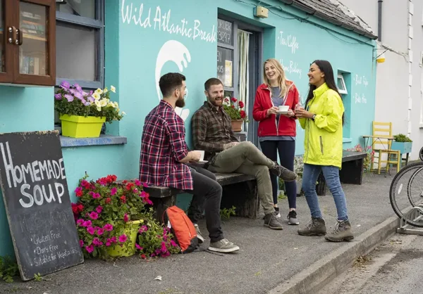 Group of friends at an outdoor Wild Atlantic Break Café in Doolin Co Clare © Failte Ireland