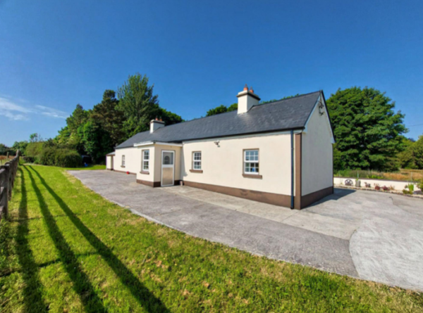 Sunny day, side view of the house, large property for rent for over 8 people in Castlerea, County Roscommon, Ireland.