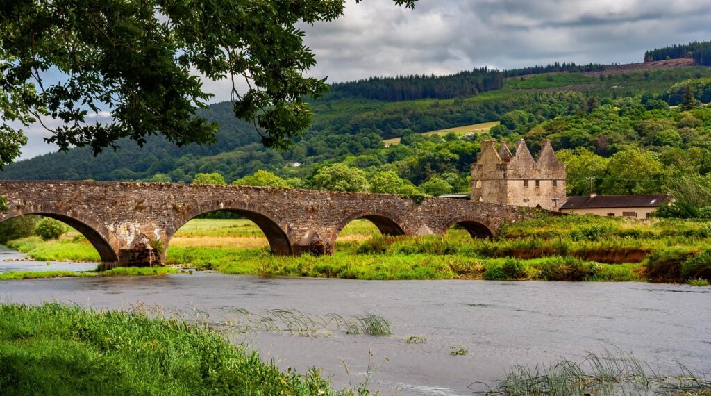 Sir Thomas arched stone bridge over River Suir connecting County Tipperary and Waterford in Ireland
