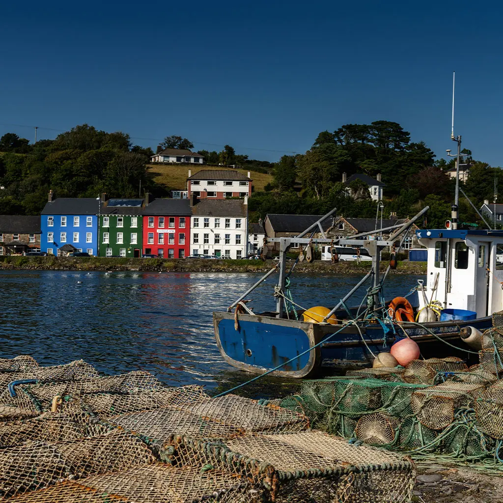 Old wooden fishing boat and fishing nets in Bantry Bay in West Cork