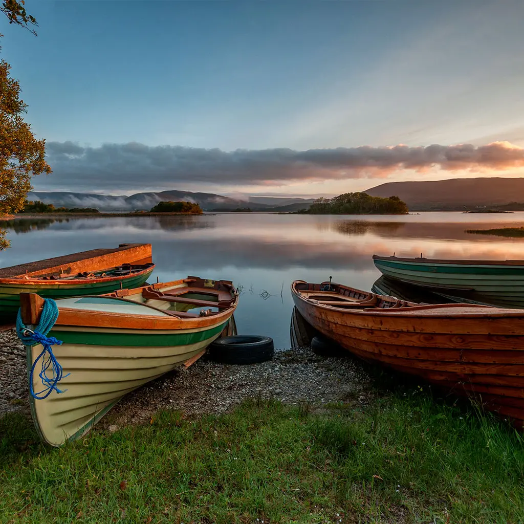 Fishing boats at the Lough Corrib beside Cornamona in Galway, an excellent base for a fishing holiday © Adobe Stock