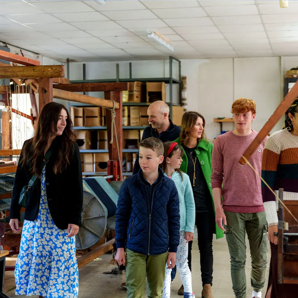 Group enjoying a tour of Studio Donegal Woolen Mill a Traditional Weaving Mill in Kilcar County Donegal © Failte Ireland