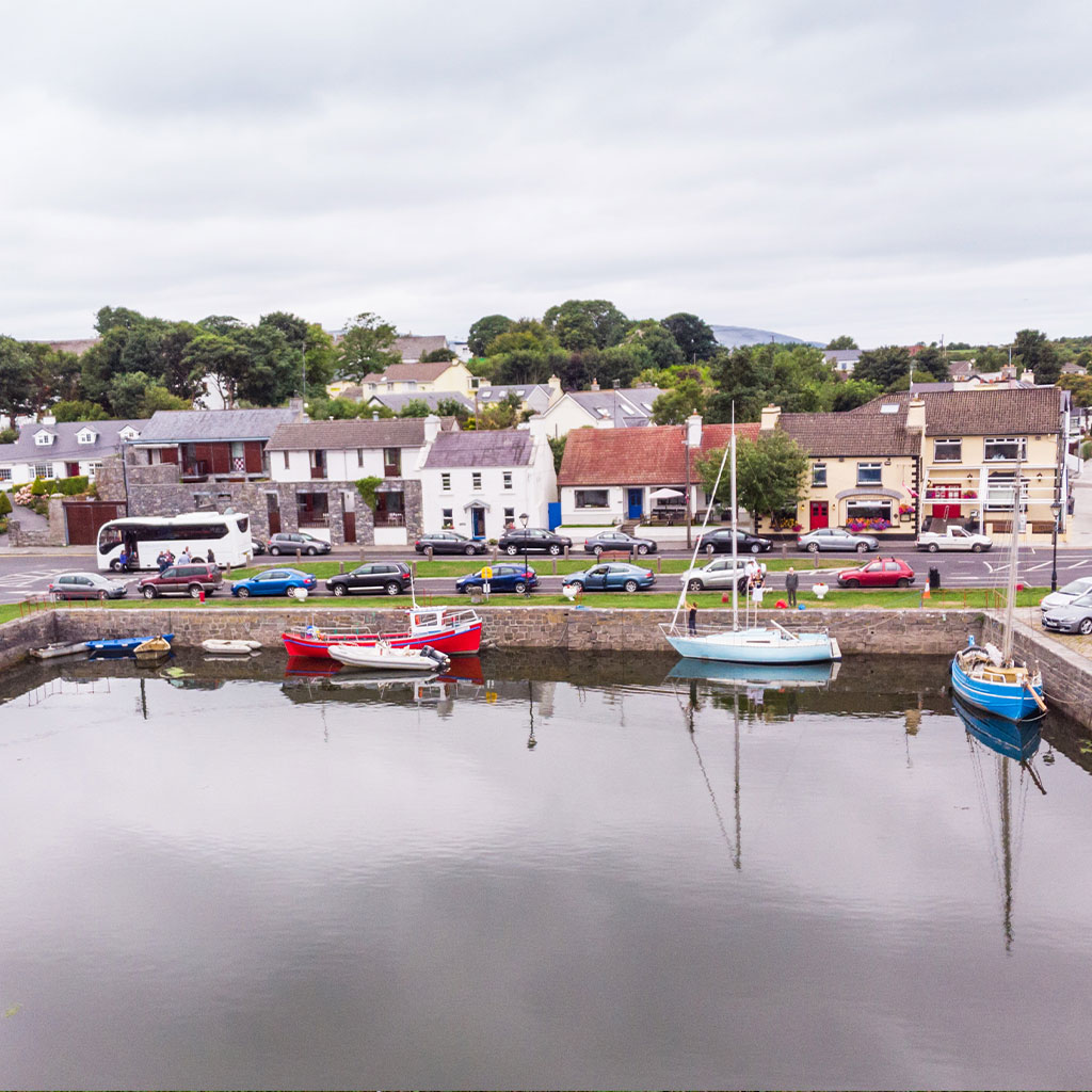 Aerial view of Kinvara village and harbour beside The Burren National Park in Galway © Adobe Stock