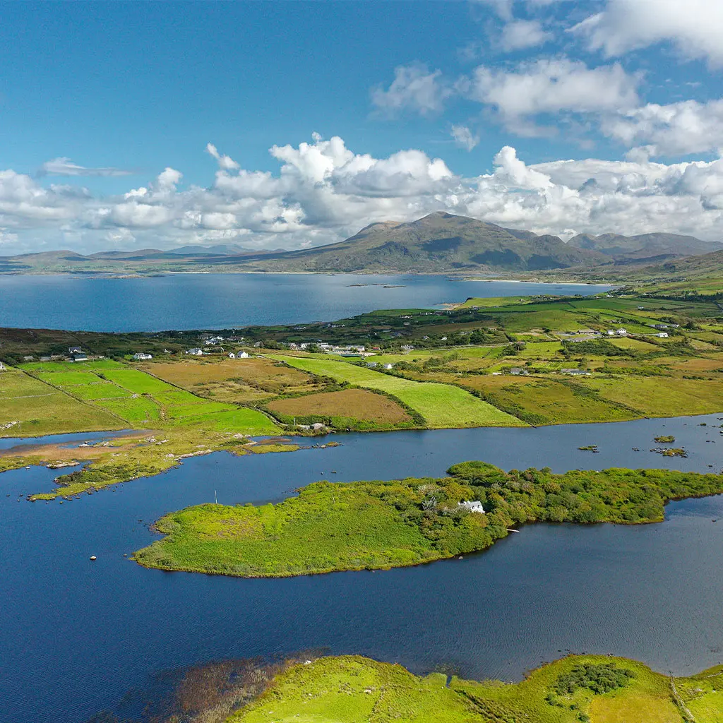 Aerial view of Tully Lough and Killary Harbour with the Mweelrea mountain in the distance in North Connemara © Adobe Stock