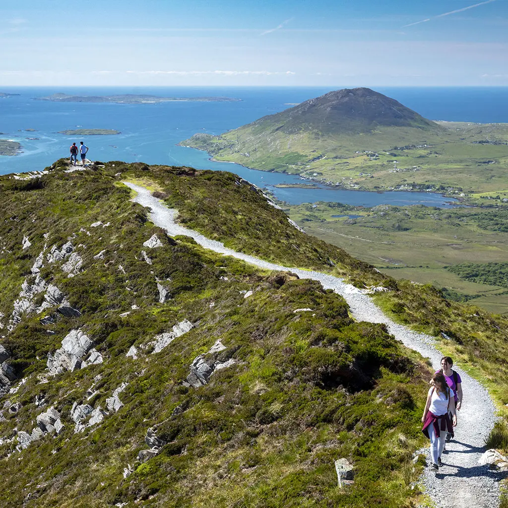 Hikers enjoying the views from Diamond Hill in Connemara National Park accessed via Letterfrack in Galway © Tourism Ireland
