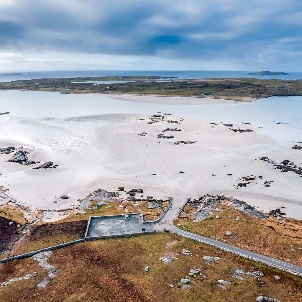 Aerial view of Omey island and beach known for is beauty and horse racing beside Claddaghduff village in Galway, Ireland © Adobe Stock