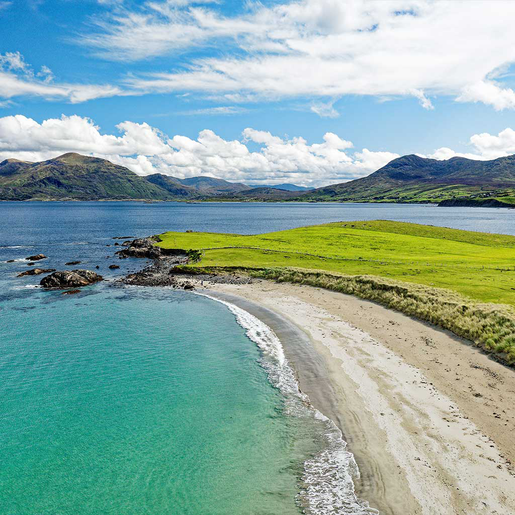 Renvyle Beach looking east to Mweelrea mountains and Killary Harbour in Connemara Galway © Adobe Stock