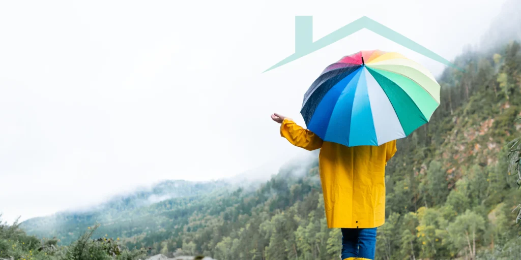 A person with the colourful umbrella - Insurance Cover Banner