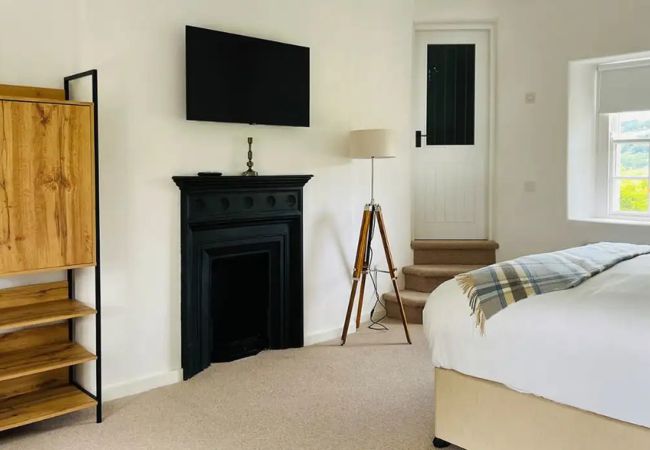 RiverLodgeBallyduffBedroomwithFireplace
